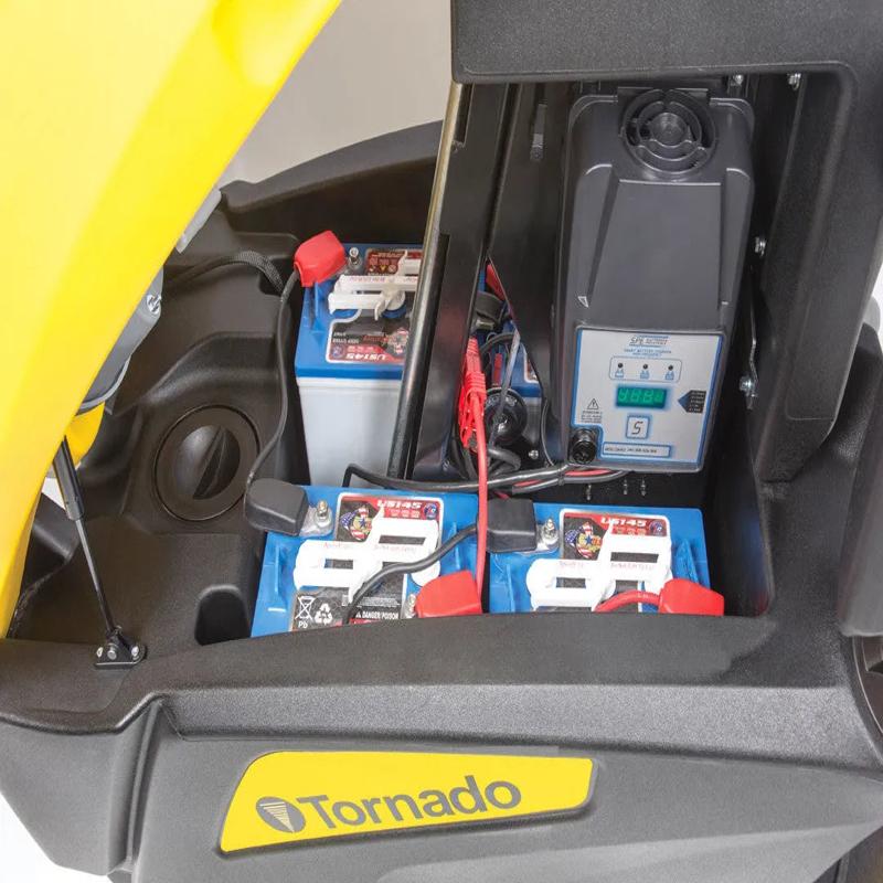Tornado BDSO 2728 open battery compartment with wiring and charger.