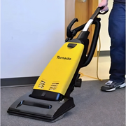 Tornado CK 141 Pro single motor upright vacuum in use on carpet person vacuuming.