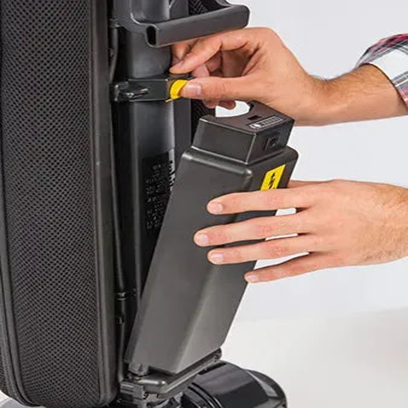 Tornado CK LW 13 1 lightweight roam battery upright vacuum battery removal closeup hands operating.