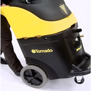 Tornado Marathon 2 200H 13 Gallon Heated Carpet Rinser side view person moving black and yellow body large wheels.