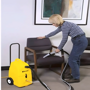 Tornado PS Professional Carpet Spotter woman cleaning chair hose.