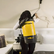 Tornado Pac Vac 10 Aircomfort in use cleaning wall.