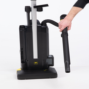 Tornado Strike Dual Motor Upright Vacuum hose attachment in use.