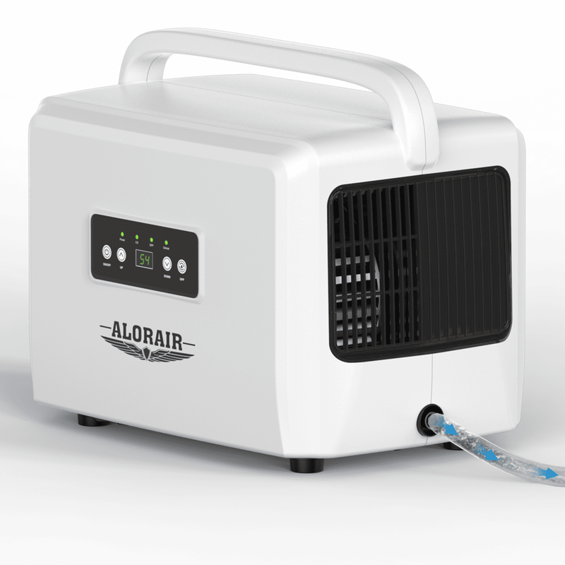 White AlorAir Helios D35 dehumidifier, front three-quarter view with its drain hose attached