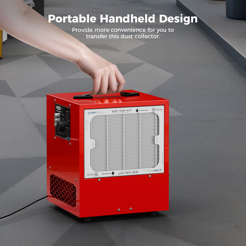Hand lifting a red AlorAir PureCare 1050 by its top handle on a shop floor, under a Portable Handheld Design caption