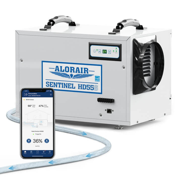 White AlorAir Sentinel HD55S WiFi dehumidifier beside a phone showing the AlorAir-C app