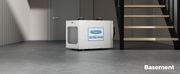 AlorAir Sentinel HDi100 on a concrete basement floor beside open stairs, captioned Basement