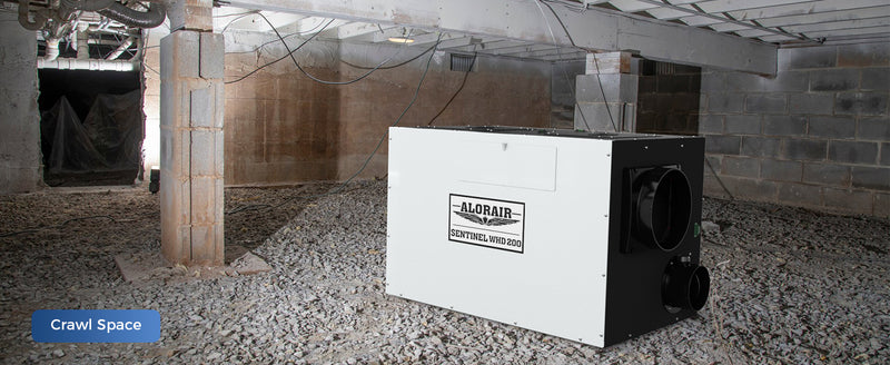 AlorAir Sentinel WHD200 on a gravel crawl space floor beside a block pier, labeled Crawl Space