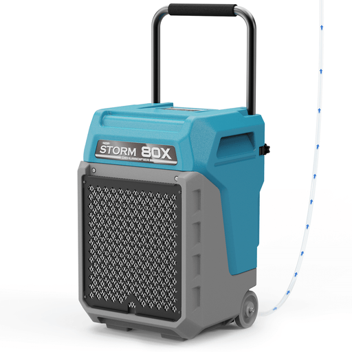 AlorAir Storm 80X in blue and gray, front three-quarter view with its handle raised and drain hose attached