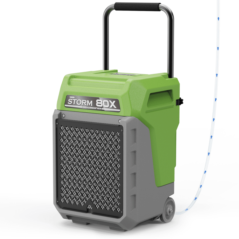 AlorAir Storm 80X in green and gray, front three-quarter view with its handle raised and drain hose attached