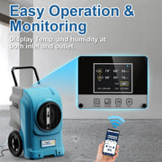 Blue AlorAir Storm Elite in a concrete room with an enlarged view of its LCD and a hand holding a phone, captioned Easy Operation and Monitoring
