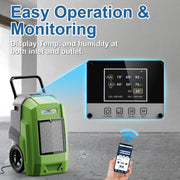 Green AlorAir Storm Pro in a concrete room with an enlarged view of its LCD and a hand holding a phone, captioned Easy Operation and Monitoring