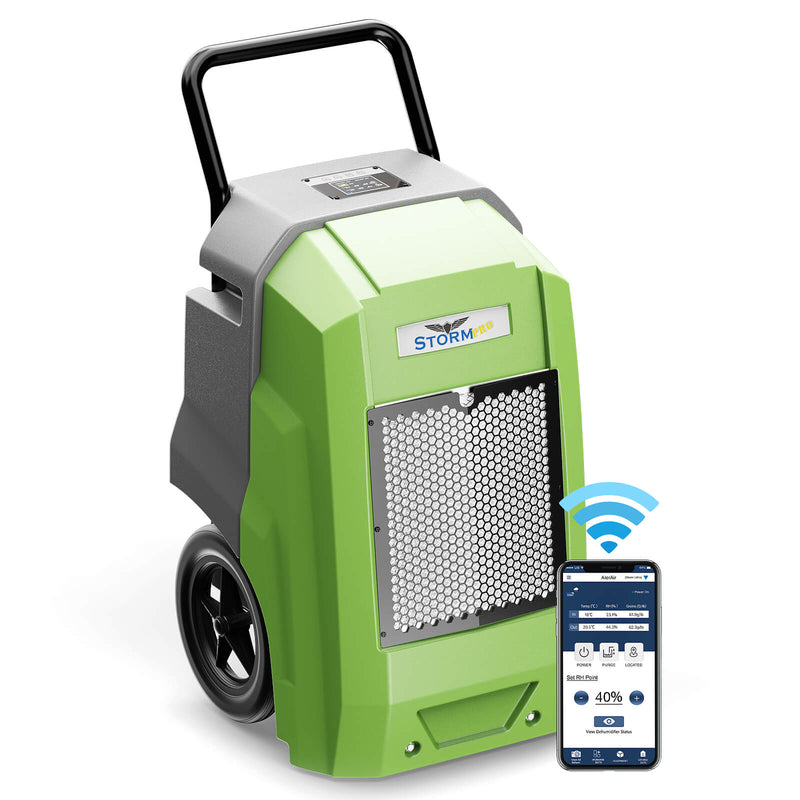 AlorAir Storm Pro in green and gray, front three-quarter view with its handle, beside a phone showing the AlorAir app