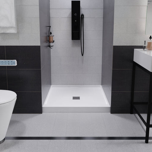 ANZZI SB-AZ102C Shower Base installed in a bathroom, front room view