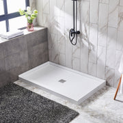 ANZZI SB-AZ106C Shower Base installed in a bathroom, angled room view