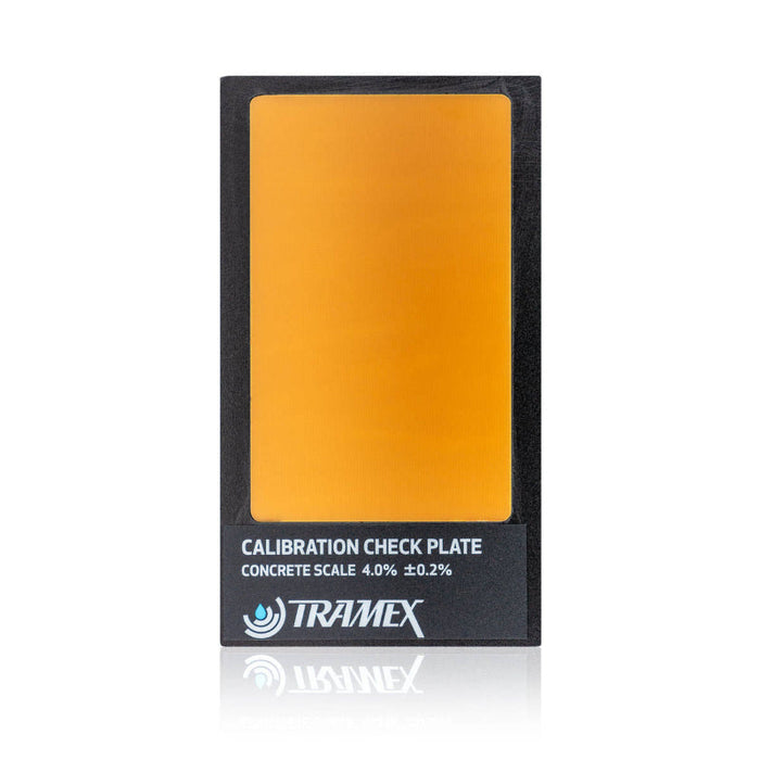 Tramex Flooring Assessment Kit - FAK Calibration Check Plate; an image showing a flat, rectangular calibration check plate used for verifying the accuracy of moisture meters, featuring a smooth surface and defined edges, placed on a surface to ensure proper alignment and measurement accuracy.