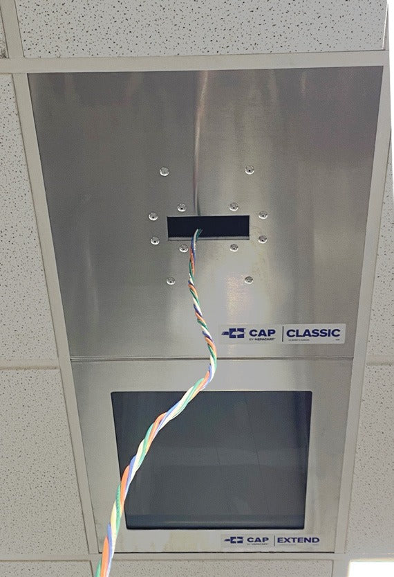 CAP Classic Combo seen from below in a ceiling grid with cable through the Classic opening