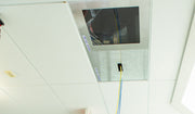 CAP Classic and CAP Extend installed in a ceiling grid with cable through the brush slot