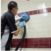 cleaning the wall with edic 700rev counter top revolution hard surface tool for effective results.
