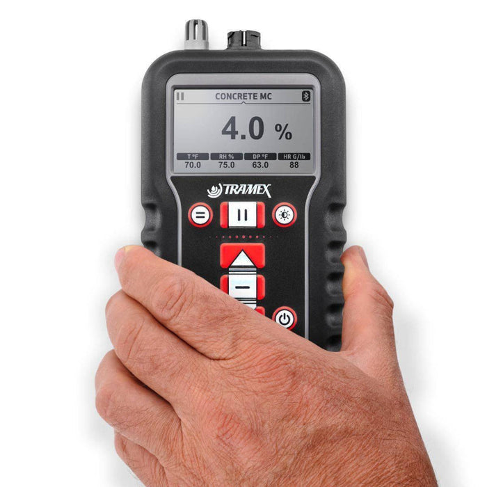 Tramex CMEX5 - Concrete Moisture Meter showing a handheld device with a digital display and various buttons, designed for measuring moisture levels in concrete surfaces.