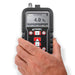 Tramex CMEX5 - Concrete Moisture Meter showing a handheld device with a digital display and various buttons, designed for measuring moisture levels in concrete surfaces.