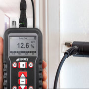 Tramex Flooring Inspector Kit - FIK Image showing the Tramex CMEX 5 moisture meter with pin probe, designed for measuring moisture levels in concrete and other flooring materials. The kit includes the device and accessories set against a neutral background.