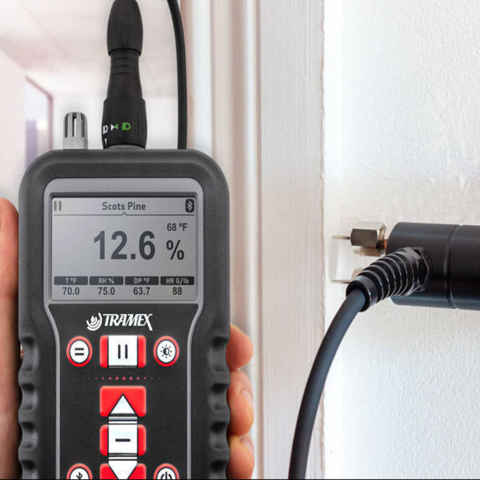 Tramex Flooring Inspector Kit - FIK Image showing the Tramex CMEX 5 moisture meter with pin probe, designed for measuring moisture levels in concrete and other flooring materials. The kit includes the device and accessories set against a neutral background.