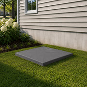 CoolGuard equipment pad set on a lawn beside a house with gray siding