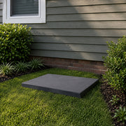 CoolGuard equipment pad on grass against a brick foundation