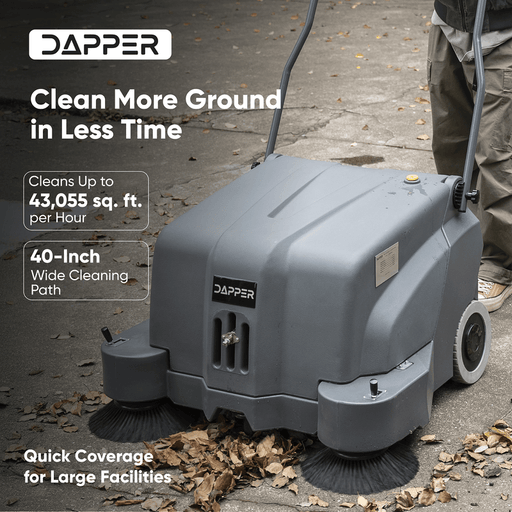 Dapper Supply 40-inch battery floor sweeper clearing leaves with its 40-inch path.
