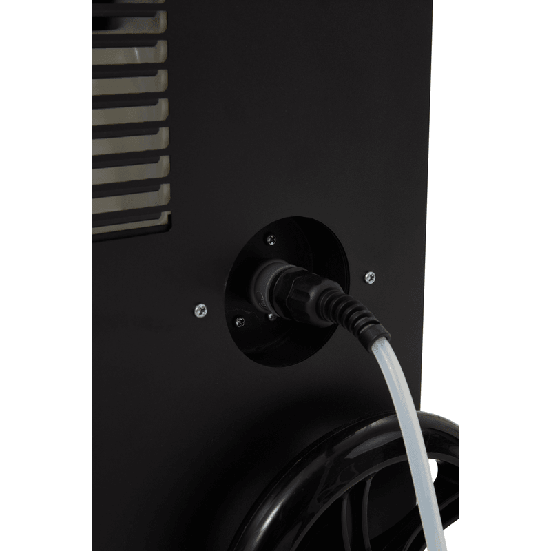 Dapper Supply commercial dehumidifier drain port connection with hose attached.