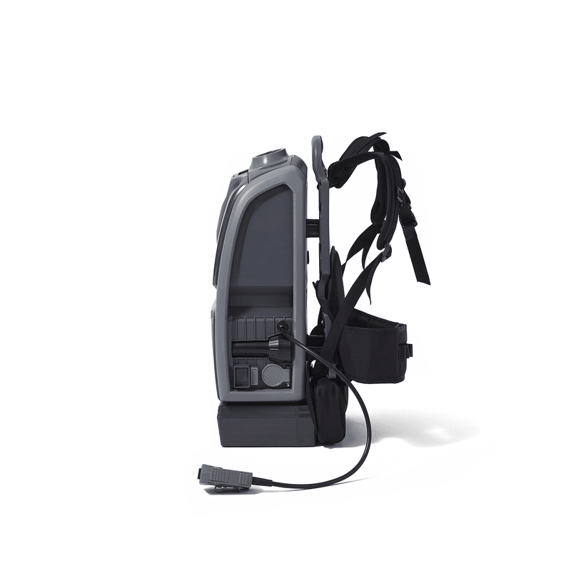 Dapper Supply cordless backpack vacuum side view with shoulder straps.