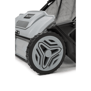 Dapper Supply lawn sweeper wheel and housing closeup.