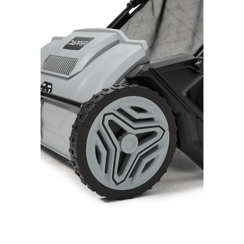 Dapper Supply lawn sweeper wheel and housing closeup.