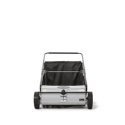 Dapper Supply push lawn sweeper front view showing brush roller and wheels.