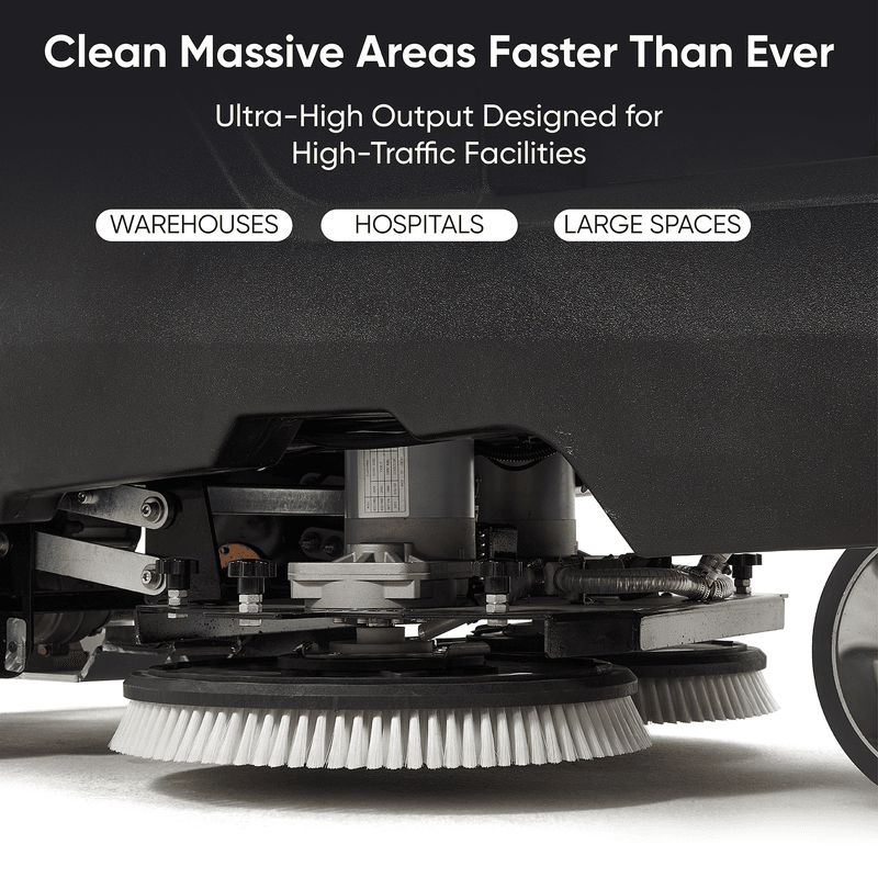 Dapper Supply ride-on floor scrubber underside showing the rotary scrub brushes.