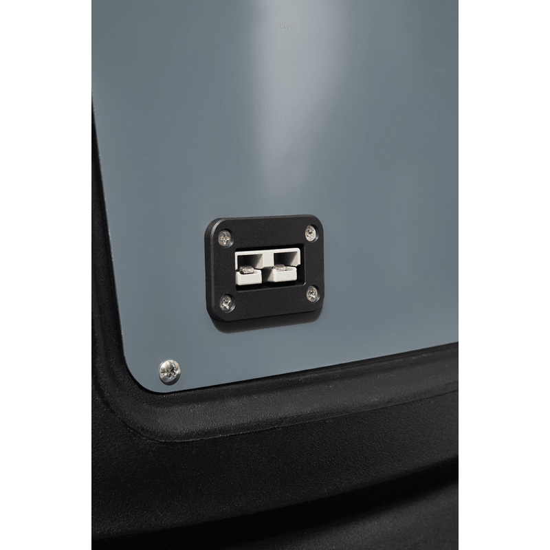 Dapper Supply ride-on floor scrubber onboard battery charging connector close up.