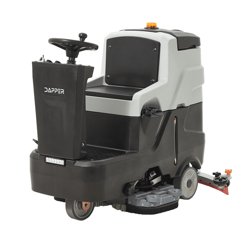 Dapper Supply ride-on floor scrubber front angle with steering wheel and brush deck.