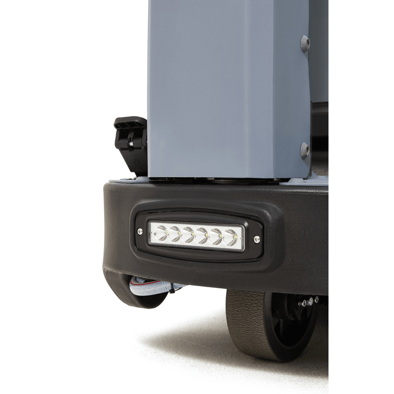 Dapper Supply ride-on floor scrubber front LED headlight close up.