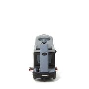 Dapper Supply ride-on floor scrubber front view showing the headlight and squeegee.