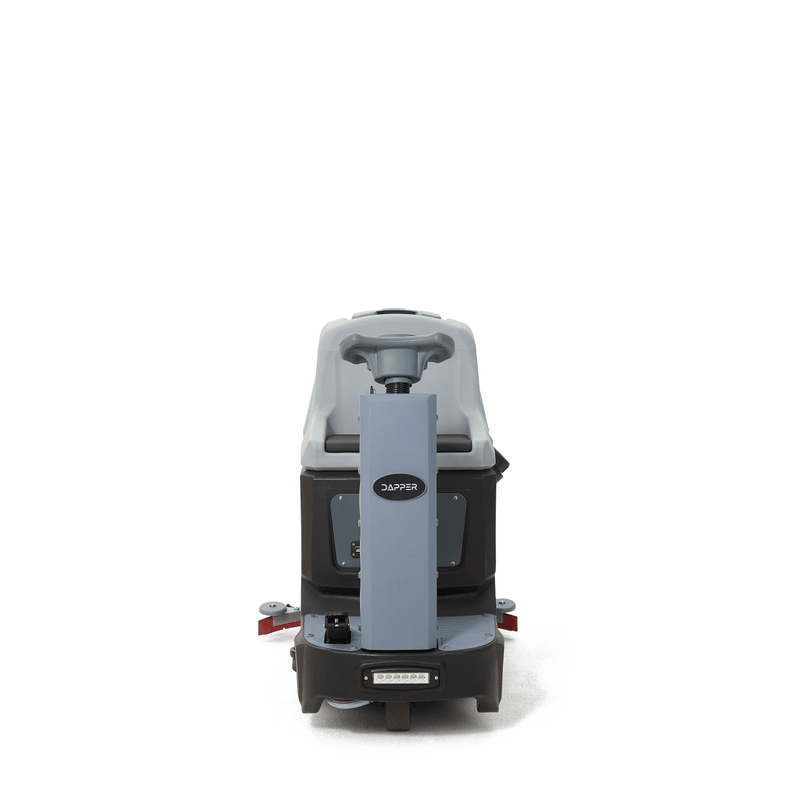 Dapper Supply ride-on floor scrubber front view showing the headlight and squeegee.