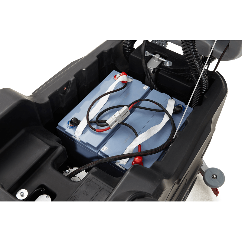 Dapper Supply ride-on floor scrubber included batteries installed in the battery compartment.