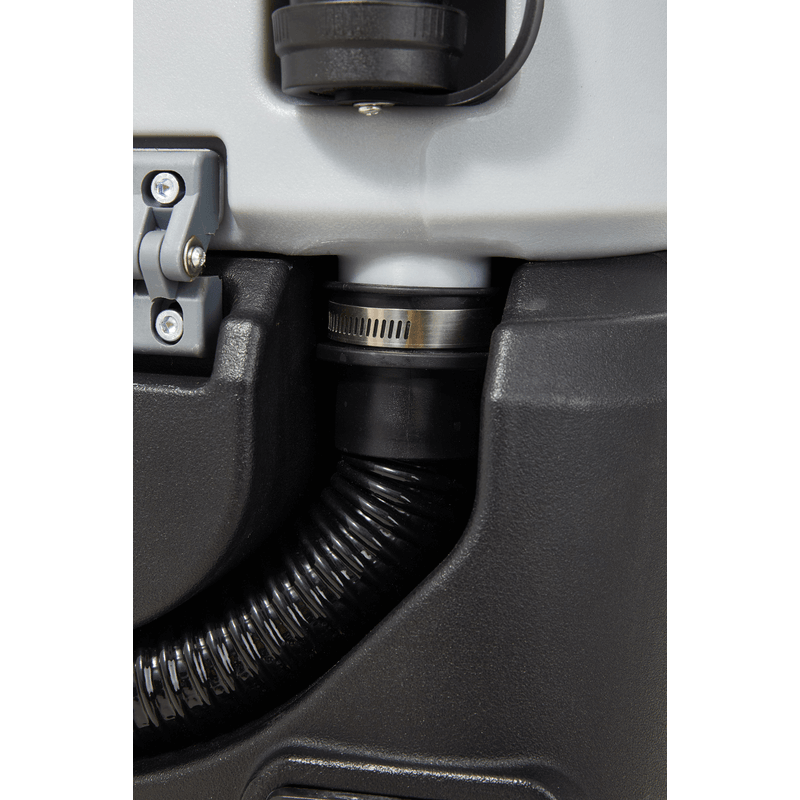 Dapper Supply ride-on floor scrubber recovery hose connection close up.