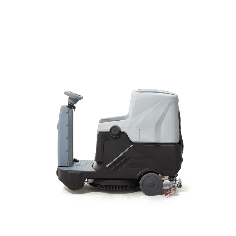 Dapper Supply ride-on floor scrubber side view showing the seat, brush deck, and squeegee.