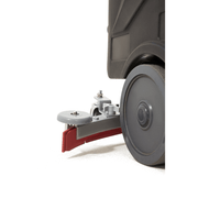 Dapper Supply ride-on floor scrubber squeegee assembly and transport wheel close up.