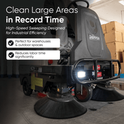 Dapper Supply ride-on sweeper cleaning a warehouse floor in use.