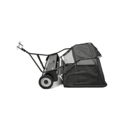 Dapper Supply tow-behind lawn sweeper side view with tow hitch.