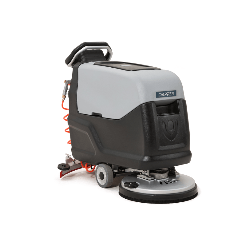 Dapper Supply self-propelled walk-behind floor scrubber shown at a front angle with brush deck.