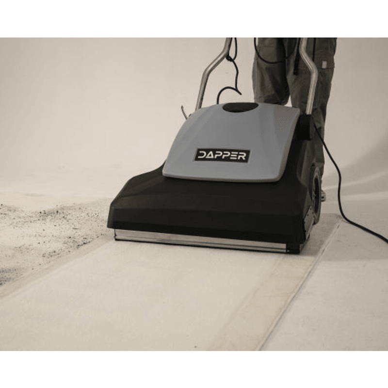 Dapper Supply 26-inch wide area vacuum cleaning toward a carpet edge in a commercial space.