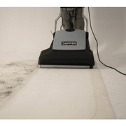 Dapper Supply 26-inch wide area vacuum cleaning a carpet showing the wide cleaning path.